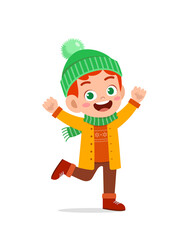 happy cute little kid play and wear jacket in winter season. child smile wearing warm clothes