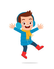 happy cute little kid play and wear jacket in winter season. child smile wearing warm clothes