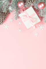 Christmas flat lay background with christmas present box on pink.