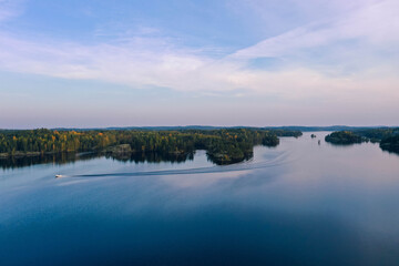 Drone shot of islands, lake and forest in autumn in Heinola, Finland