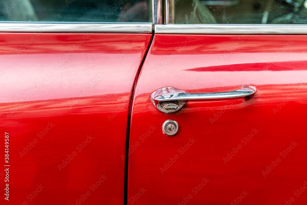 Wall mural Red 60s classic car door handle