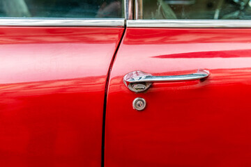 Red 60s classic car door handle