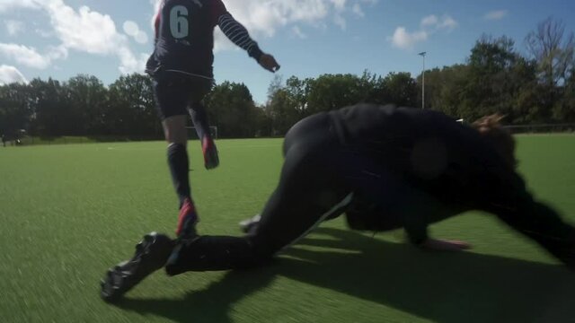 Man playing soccer with tackle