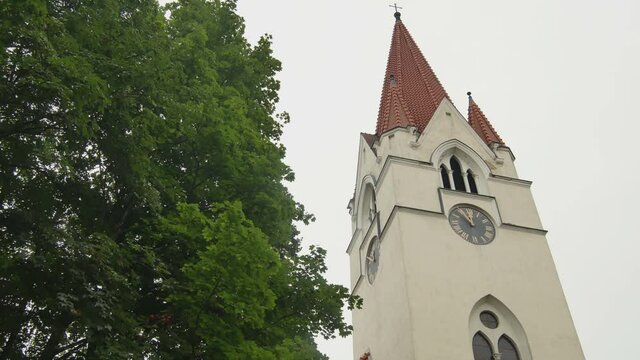 Clock on the Tower of Evangelical Lutheran Church In  Silute, Lithuania.