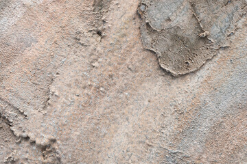 The picture of a cement wall that has been built for a long time