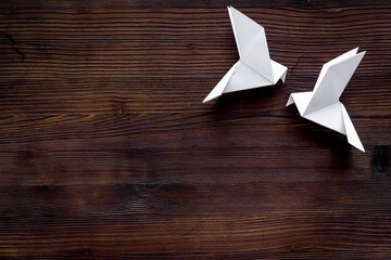 Origami concept. Paper birds top view, copy space
