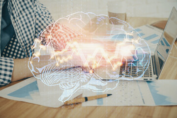 Man typing on keyboard background with brain hologram. Concept of big Data. Double exposure.