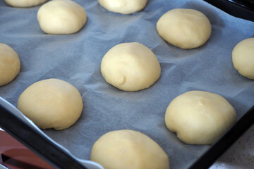 Fototapeta na wymiar Knead the dough at home, close-up of fresh pie dough kneaded,