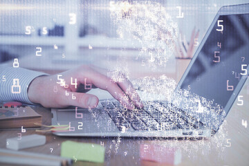 Technology theme hologram with man working on computer on background. High tech concept. Double exposure.