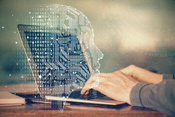Man typing on keyboard background with brain hologram. Concept of big Data. Double exposure.