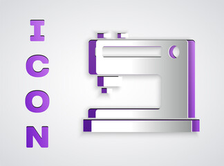 Paper cut Sewing machine icon isolated on grey background. Paper art style. Vector Illustration.