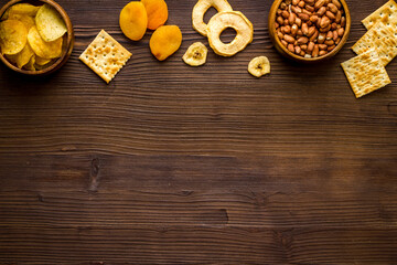 Fototapeta premium Mix of snacks - nuts and dried fruits, flat lay, top view