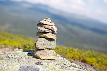Stacked stones on top mountain in nature, selective focus on stones
