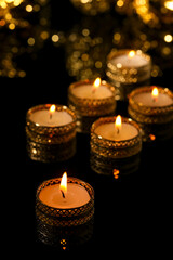 Indian festival diwali , candle on dark background