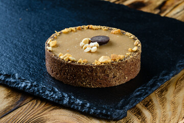 sweet tartlet dessert on a stone tray