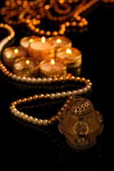 Indian festival diwali , candle on dark background