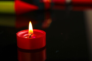 Diwali Diya with Fire Crackers over rangoli background