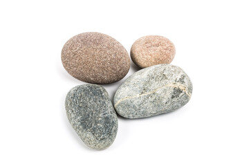 Fototapeta na wymiar Studio photo of stacked, natural stone pebbles isolated on white background with soft shadow.