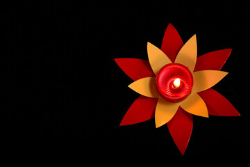 Indian festival diwali , candle on dark background