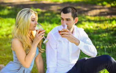 cheers. girl and man travel together. couple in love drinking wine during romantic dinner in park. romantic picnic of couple in love. family relationship and friendship. nice summer holiday