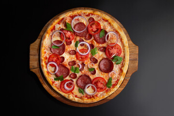 pizza with tomatoes, pepperoni and herbs