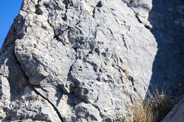 Stone rock in the mountains as an abstract background.