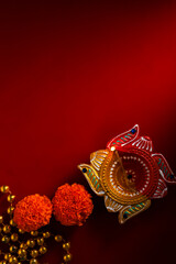 happy diwali or happy deepavali greeting card made using a photograph of diya or oil lamp