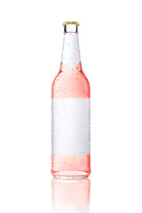 One transparent bottle with blank label. Glass bottle with pink drink covered with water drops.