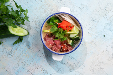 tuna tartare with avacado and herbs in a plate