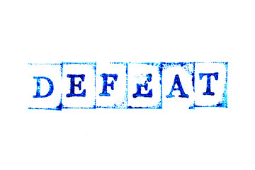 Blue color ink of rubber stamp in word defeat on white paper background