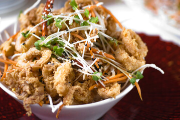 Calamari served with spicy and sweet dipping sauces. Classic American restaurant or French bistro appetizer favorite. Fresh octopus, squid and shrimp battered and deed fried.