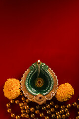 happy diwali or happy deepavali greeting card made using a photograph of diya or oil lamp