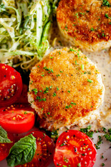 Crab cake served w/ spicy rémoulade sauce on top of a mixed green salad. Jumbo crab meat mixed w/ garlic, onions, spices & fried in butter. Classic American restaurant appetizer.