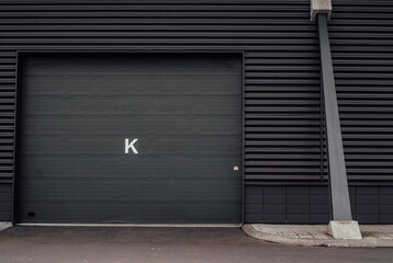all black garage facade with the black door