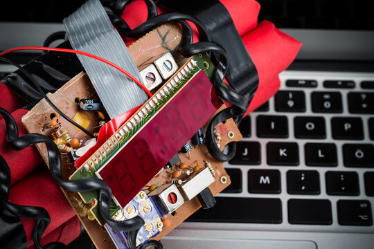 Closeup of home made bomb with digital display, wires and circuit board.