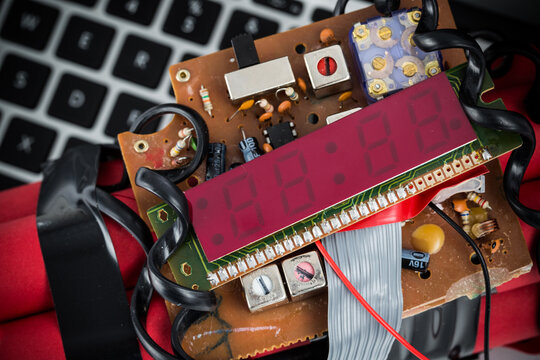 Closeup of home made bomb with digital display, wires and circuit board.