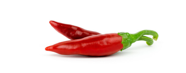panoramic photo of a chili pepper. Two green chili peppers isolated on a white background.