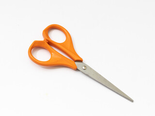Orange scissor with white background.
