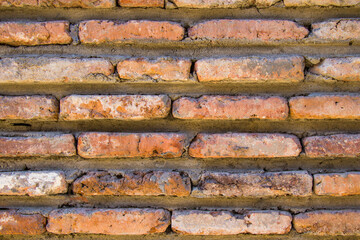 Wall background close-up, red stone background