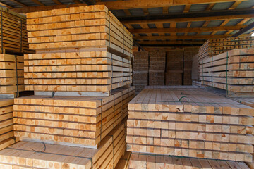 Piles of wooden boards in the sawmill, planking.