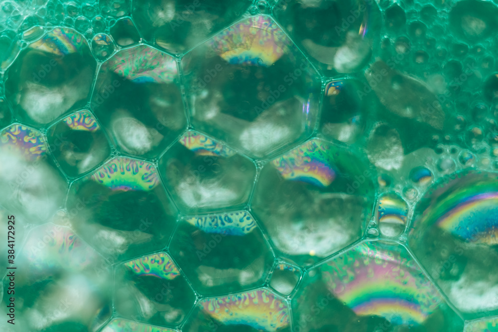Fototapete close up beautiful green abstract soap bubbles. background pattern for design. macro photography vie