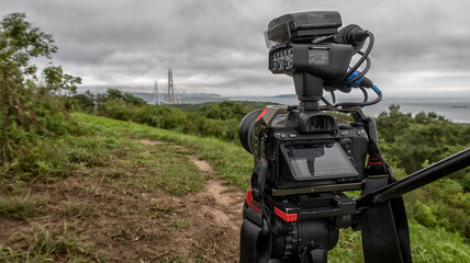 close-up of a camcorder filming summer landscapes