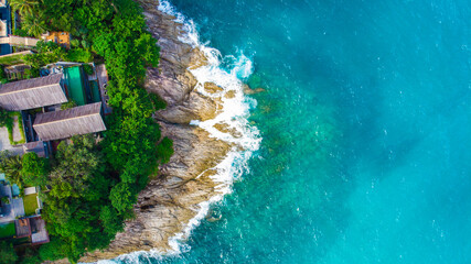 Idyllic resort accommodation on island sea beach turquoise sea water aerial view