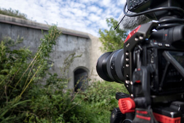 close-up of a camcorder filming summer landscapes