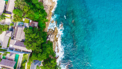 Idyllic resort accommodation on island sea beach turquoise sea water aerial view
