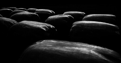 Fototapeta premium Bales of hay wrapped in plastic wrap