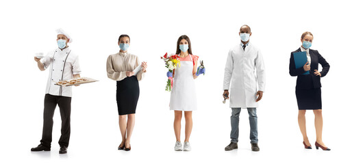 Group of people with different professions on white studio background, horizontal. Modern workers of diverse occupations, male and female models like florist, doctor, accountant, baker in face masks