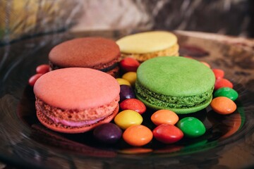 colorful macaroons on wooden background