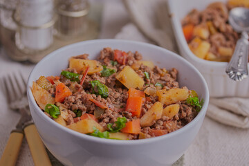 Minced beef with vegetables and herbs.