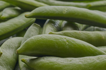 Green peas in pods shot close up.